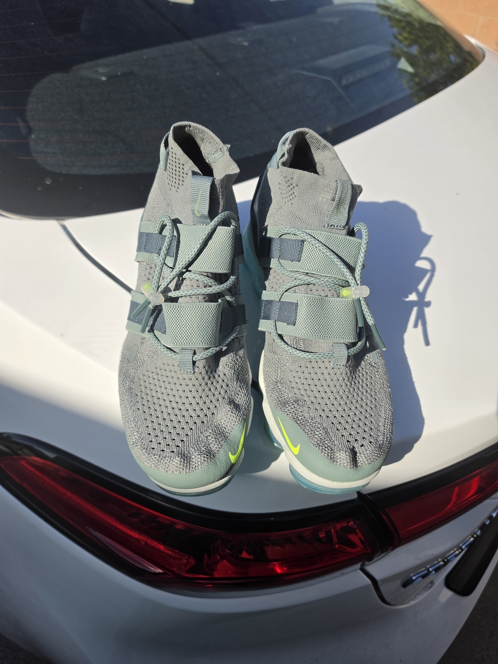 Nike Women’s Grey and Mint Green Slip-On Sneakers with Neon Accent